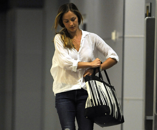 Coach Minka Kelly travels with a very special Coach tote bag