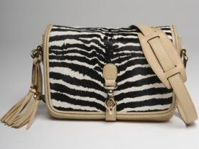Gucci Resort 2012: Zebra Prints and Collection Context — hardware and construction detail